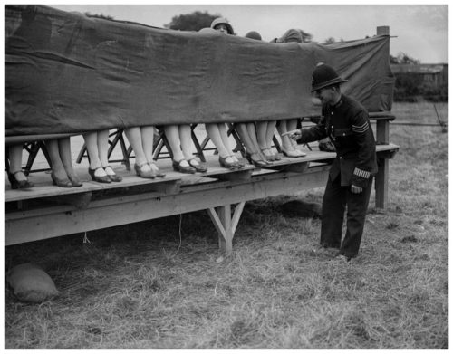 A+policeman+judges+an+ankle+competition+at+Hounslow,+London,+ca.+1930